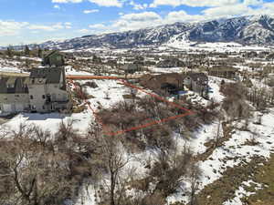 Snowy aerial view with a mountain view