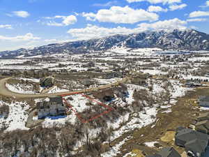 Snowy aerial view with a mountain view