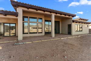 Back of property with a patio area