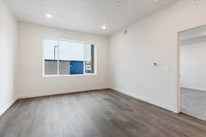 Unfurnished room featuring hardwood / wood-style floors