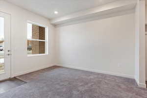 Empty room featuring carpet floors