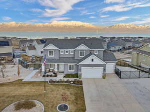 View of front of house featuring a lake and mountain view