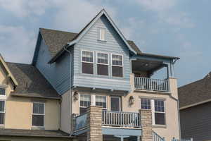 View of front of property with a covered porch and two raised decks