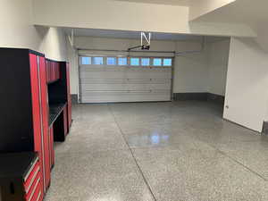 4-car tandem garage featuring epoxy flooring