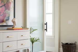 Barn door leading to a half bath and flex room