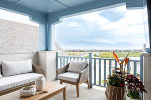 Upper deck from primary featuring a mountain view and fireplace