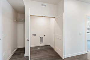 Laundry room featuring dark hardwood / wood-style flooring, washer hookup, and hookup for an electric dryer