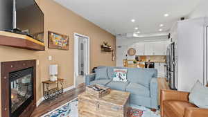 Living room with light hardwood / wood-style floors