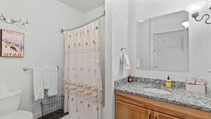 Bathroom with vanity and toilet