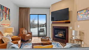 Living room with hardwood / wood-style flooring