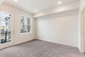 View of carpeted spare room