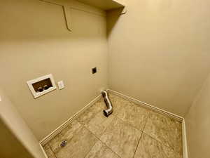 Laundry area featuring electric dryer hookup and washer hookup