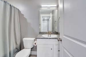 Bathroom with toilet and vanity