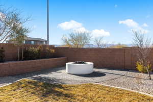 Exterior space featuring an outdoor fire pit and a patio area