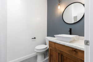 Bathroom featuring toilet and vanity