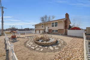 Back of property featuring a garage