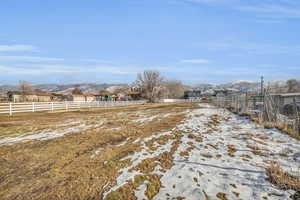 View of yard featuring a rural view and a mountain view