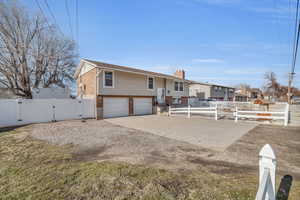 View of front of property featuring a garage