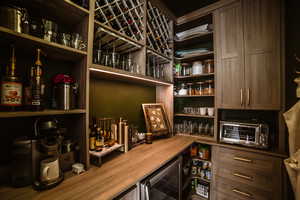 Pantry featuring wine cooler