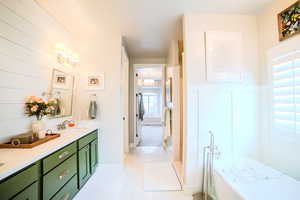 Bathroom featuring vanity and tile patterned flooring