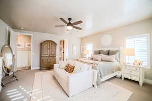 Bedroom featuring ceiling fan and light carpet