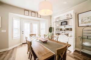 Dining area featuring wood-type flooring