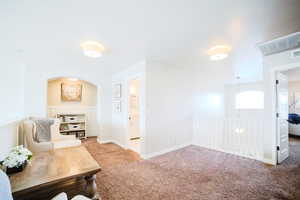 Sitting room featuring carpet