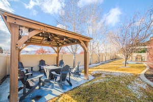 View of patio / terrace with a gazebo and ceiling fan