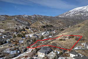 Snowy aerial view featuring a mountain view