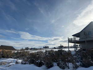 View of yard layered in snow