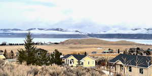 Exterior space with a water and mountain view and a rural view