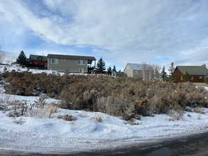 View of yard layered in snow