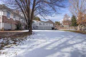 View of yard covered in snow