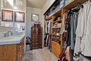 Walk in closet with sink