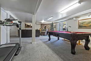 Recreation room featuring light colored carpet and pool table