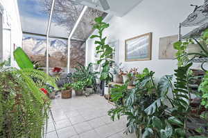 Interior space featuring a patio area, a mountain view, and ceiling fan