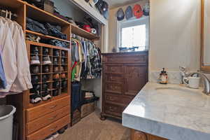 Walk in closet featuring sink