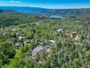 Aerial view featuring a water and mountain view