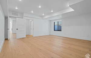 bedroom Empty room with light wood-type flooring