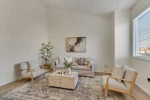 Living room featuring hardwood / wood-style floors and a wealth of natural light