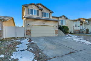 View of property featuring a garage