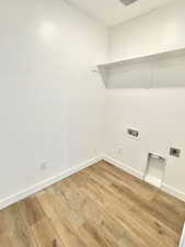 Laundry area with washer hookup, hookup for an electric dryer, and hardwood / wood-style flooring