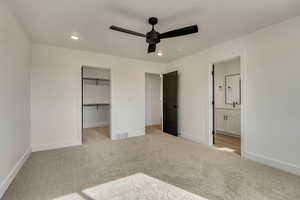 Unfurnished bedroom with carpet flooring, baseboards, and visible vents