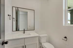 Half bath with toilet and vanity