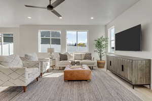 Living room featuring ceiling fan