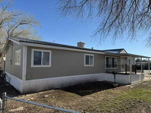 View of property exterior featuring a porch