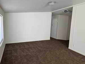 View of carpeted spare room