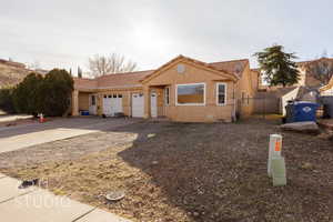 View of front facade featuring a garage