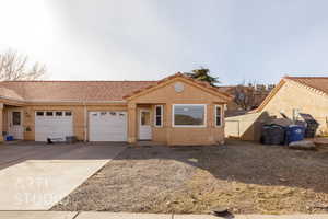 View of front of property with a garage