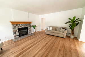 Living room featuring a fireplace and light hardwood / wood-style floors